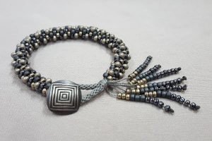kumihimo_bracelet_tassle-button_Beadology-Iowa Kumihimo Bracelet with Button Closure